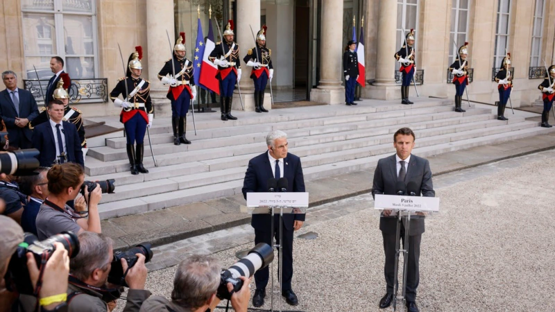 Israel's Lapid Meets Macron in Paris on First Trip as PM