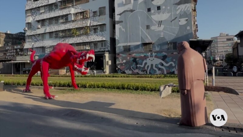 Taiwan Sculpture Warrior Faces Red Monster