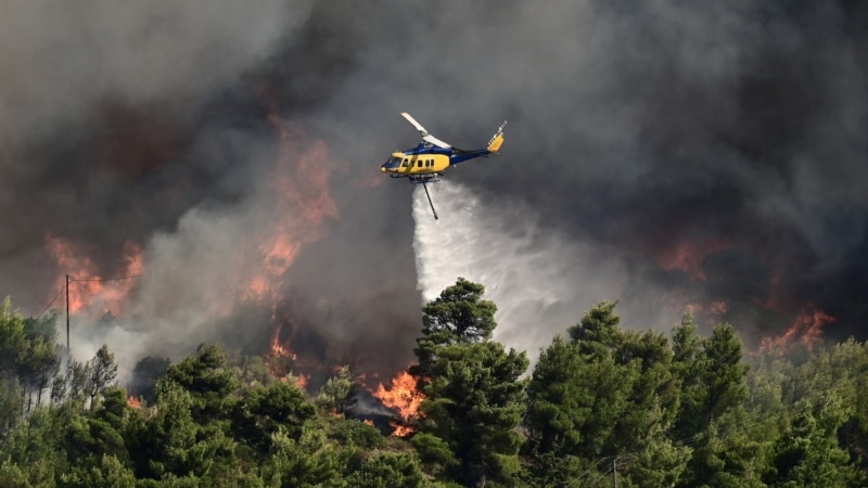 Greek residents flee as wildfire rages uncontrolled near Athens