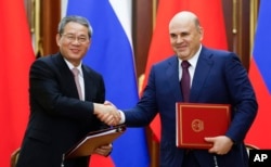 China looks to reaffirm ties with Russia through premier's trip