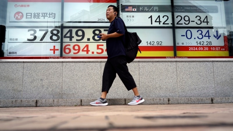 Asian stocks follow Wall Street's rate cut rally higher