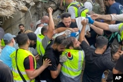 Israel says Beirut strike killed top Hezbollah official; 14 dead, Lebanon says   